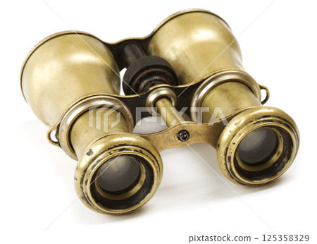 Vintage binoculars on white 125358329