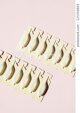 Two Rows of Pharmaceutical Ampoules in Blister Pack. Mockup for Drug Advertisement and Design Usage. 125358603