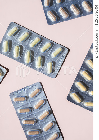 Several Blisters of Dietary Supplement Capsules, Vitamins or Natural Remedies Pills for Health and Wellness. Several Blisters of Dietary Supplement Capsules, Vitamins or Natural Remedies Pills for Health and Wellness. 125358604