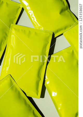 Bright Foil Identity Packages Mockup. Cosmetic or Food Packaging for Product Advertisement. 125358607