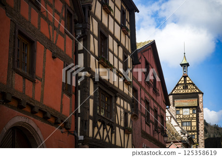 Charming medieval street with tower in Riquewihr in Alsace, France Charming medieval street with tower in Riquewihr in Alsace, France 125358619