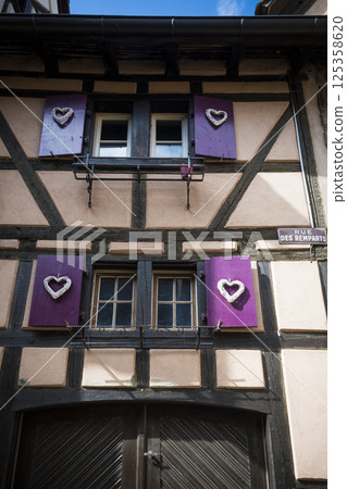 Romantic building with heart shutters in Riquewihr, Alsace, France Romantic building with heart shutters in Riquewihr, Alsace, France 125358620