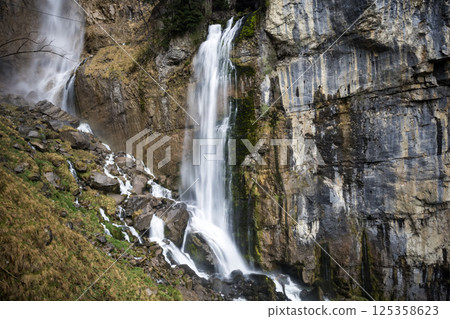 Seerenbach Falls cascading down by Lake Walensee in Switzerland Seerenbach Falls cascading down by Lake Walensee in Switzerland 125358623