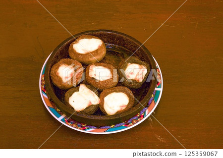 the national Georgian dish is champignons baked with cheese in a special cast-iron dish in the oven the national Georgian dish is champignons baked with cheese in a special cast-iron dish in the oven 125359067