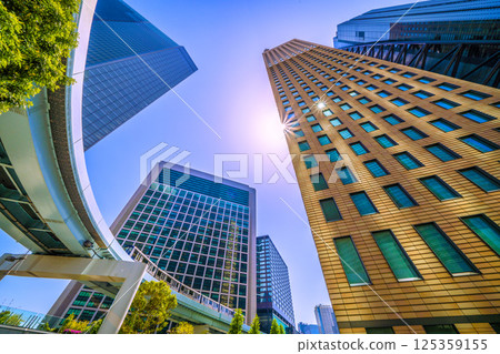 Tokyo cityscape in Japan: A rare sight of the W Diamond...view of the Shiodome buildings and Yurikamome line (continuous parking available) 125359155