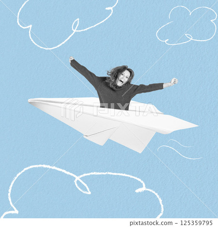 Happy woman in paper airplane 125359795