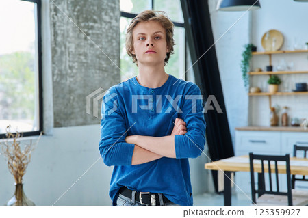 Portrait of confident serious teenage boy with crossed arms Portrait of confident serious teenage boy with crossed arms 125359927