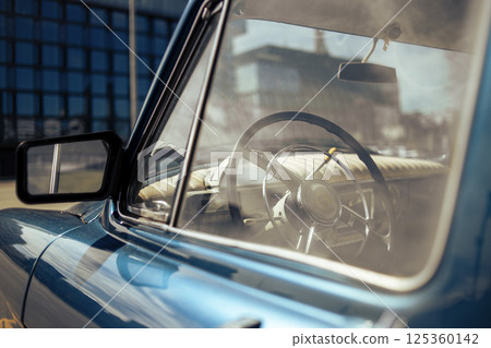steering wheel of an old car Gaz-21 125360142