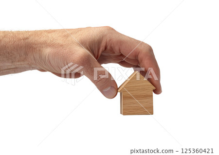 hand firmly grasping a small home model, symbolizing property ownership, isolated on a white background 125360421