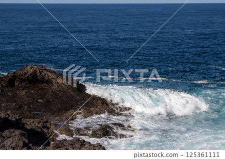 Coastal rocks and Atlantic ocean, Gran Canaria, Spain Coastal rocks and Atlantic ocean, Gran Canaria, Spain 125361111