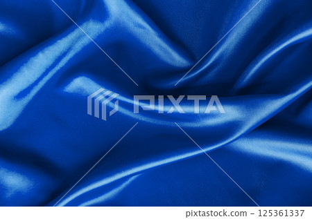 Polished blue silk cloth with silky sheen and beautiful natural draping. Suitable for design and wallpaper background. 125361337