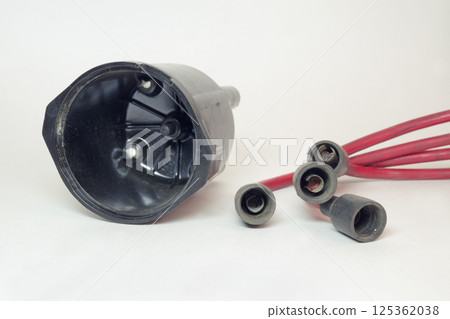 ignition distributor cap inner side. set of high tension cables, rubber boots on terminals ignition distributor cap inner side. set of high tension cables, rubber boots on terminals 125362038