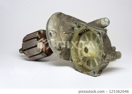 car windshield wipers motor, disassembled, plastic ring gear in dirty gear housing, in grease, armature. selective focus 125362046