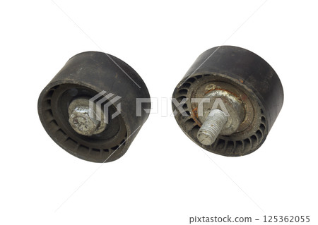 timing belt tension pulley. Pair of rollers, used pulley with bolt, both sides. isolated on white background timing belt tension pulley. Pair of rollers, used pulley with bolt, both sides. isolated on white background 125362055