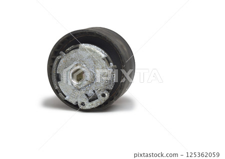 timing belt tensioner roller, threadbare, with white cover of corrosion flakes. Part of car timing mechanism, dismantled for replacing. isolated on white background, with clipping path 125362059