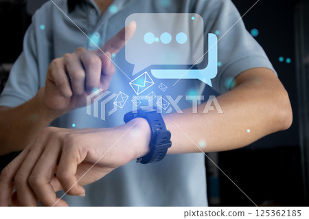 Business concept using smartwatch to communicate and reply to messages Business concept using smartwatch to communicate and reply to messages 125362185