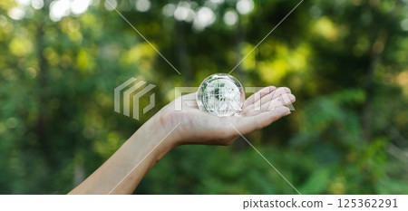 Protecting the world and the environment concept, globe in hand 125362291