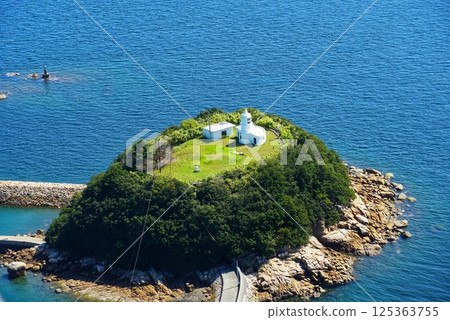 Lighthouse and island overlooking the sea Lighthouse and island overlooking the sea 125363755