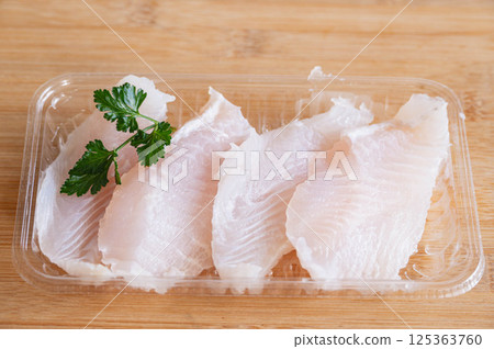 Pangasius fillets in food pack Pangasius fillets in food pack 125363760
