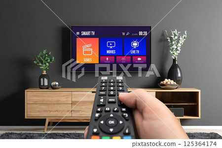 Watching TV, VOD service on TV. 125364174