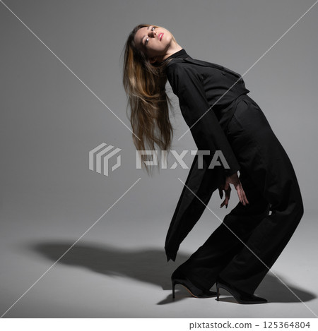 Beautiful woman with tailcoat studio portrait 125364804