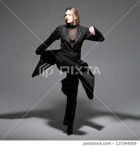 Beautiful woman with tailcoat studio portrait Beautiful woman with tailcoat studio portrait 125364806