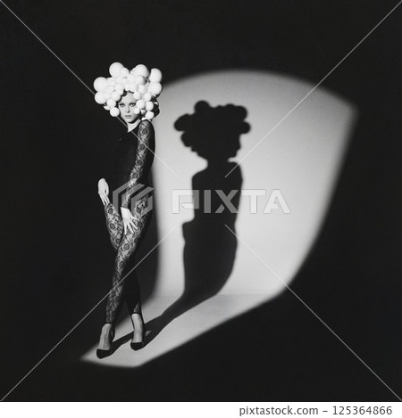 Fashion Model with Unique Headpiece and Shadow Fashion Model with Unique Headpiece and Shadow 125364866