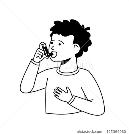 A boy treats his asthma with an inhaler. A boy treats his asthma with an inhaler. 125364980