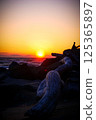 Driftwood and sunset 125365897