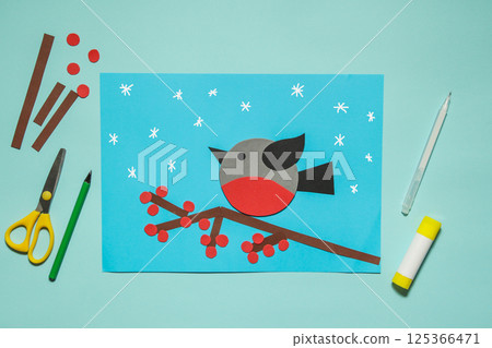 Winter bird bullfinch made of paper. Winter Craft kids. Workshop. Kindergarten and school. 125366471