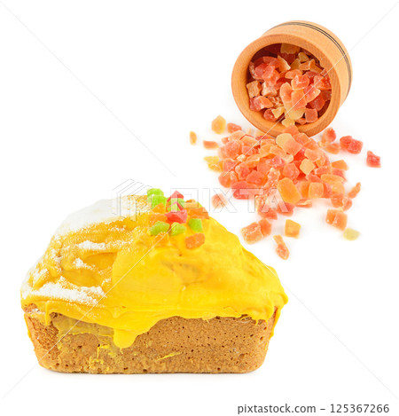 Honey cake and candied fruit in a wooden bowl isolated on white background. 125367266
