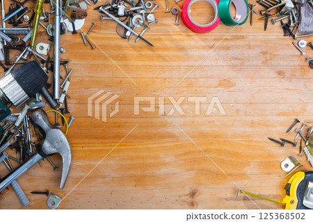 Hand tools for repairing on wooden surface in workshop 125368502