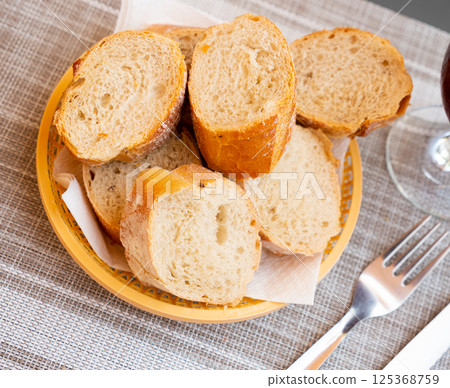 Served bread in wicker plate 125368759