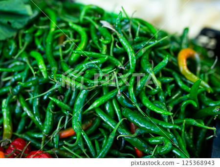 Fresh green anaheim peppers on counter market. Organic vegetable Fresh green anaheim peppers on counter market. Organic vegetable 125368943