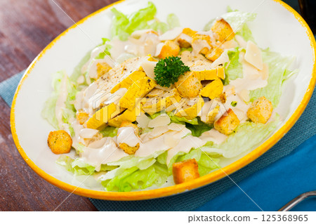 Caesar salad with grilled chicken 125368965