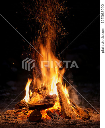 Campfire Glow at Night 125368990
