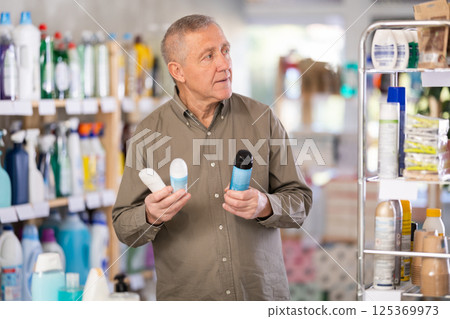 Older Man Chooses Deodorant Older Man Chooses Deodorant 125369973