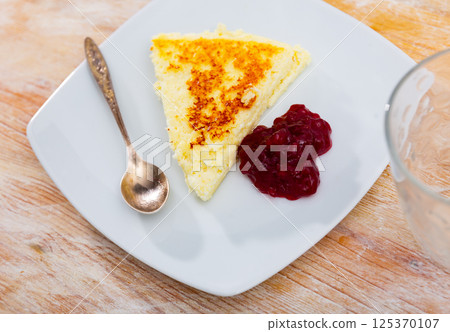 Cottage cheese casserole served with jam Cottage cheese casserole served with jam 125370107