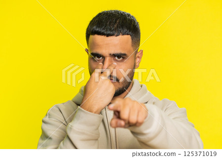 Man pointing at her eyes and camera show I am watching you gesture spying watching on someone Man pointing at her eyes and camera show I am watching you gesture spying watching on someone 125371019