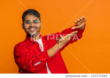 Man showing wasting throwing sharing money, more tips, big profit winning lottery jackpot shopping 125371044