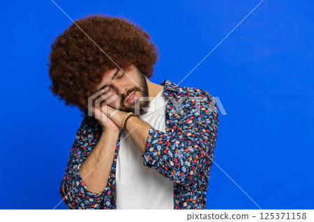 Tired exhausted young man lazy bored lack of sleep, falling asleep taking a break relaxing Tired exhausted young man lazy bored lack of sleep, falling asleep taking a break relaxing 125371158