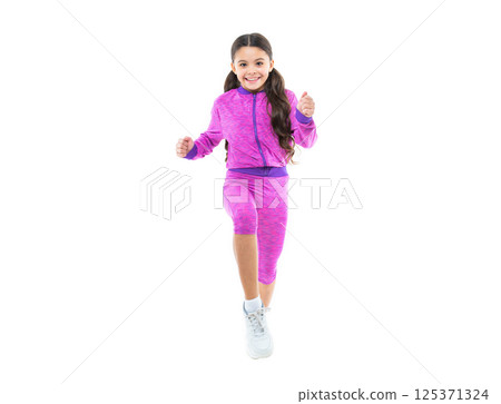 cheerful teen sport girl run in studio. teen sport girl run on background. photo of teen sport girl 125371324