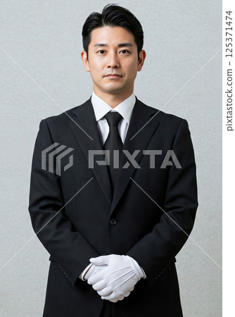 Portrait of a polite male staff member wearing white gloves (AI-generated image) 125371474