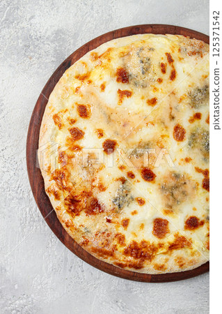Freshly baked cheese pizza, white pizza, on a wooden plate, homemade, no people, Freshly baked cheese pizza, white pizza, on a wooden plate, homemade, no people, 125371542