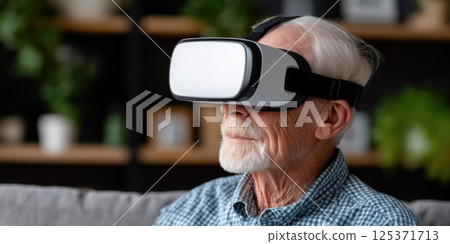 Senior Man Wearing VR Glasses Indoors 125371713