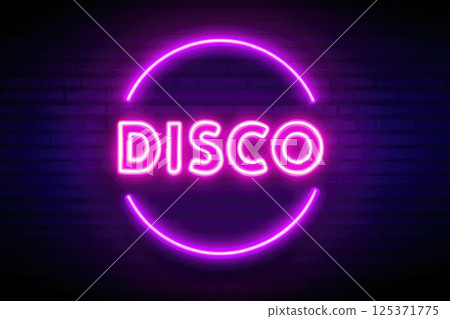 Neon Disco Sign Illuminated on Brick Wall 125371775