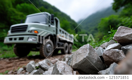 Off-Road Truck Driving through Rocky Forest Terrain 125371851