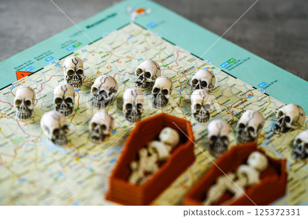 Many skulls on the map of Ukraine near the inscription Sumy, Kharkov, a symbol of victims of war 125372331