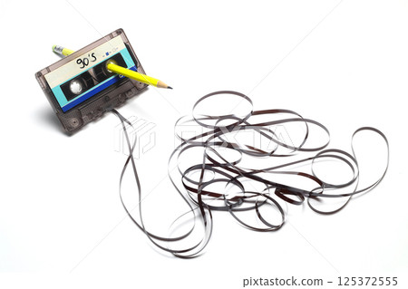 A pen for rewind cassette tape compact retro on white background. 90's concepts. A pen for rewind cassette tape compact retro on white background. 90's concepts. 125372555
