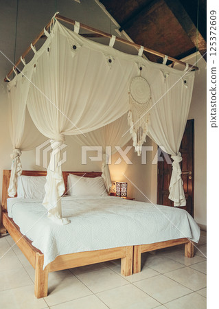 Traditional balinese cozy canopy bed Traditional balinese cozy canopy bed 125372609